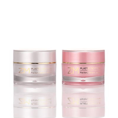 ピンクの贅沢なボディ バター包装のクリーム色の瓶Skincareはねじ帽子の金の縁の化粧品の容器によってごしごし洗う